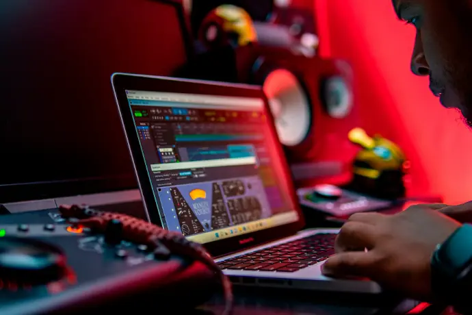 a man sitting in front of a laptop computer